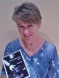 Picture of Annie Kerr holding a copy of Prole magazine, where she has 2 poems published