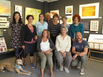 Annie Kerr and fellow artists in front of their work at Laughing Dog Gallery, Brighton Marina 